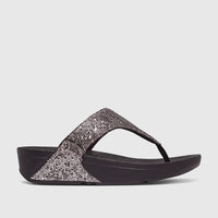Fit Flop Ladies Comfort Sandal Lulu Glitterball with silver glitter straps and a black comfort sole, shown in a side view.