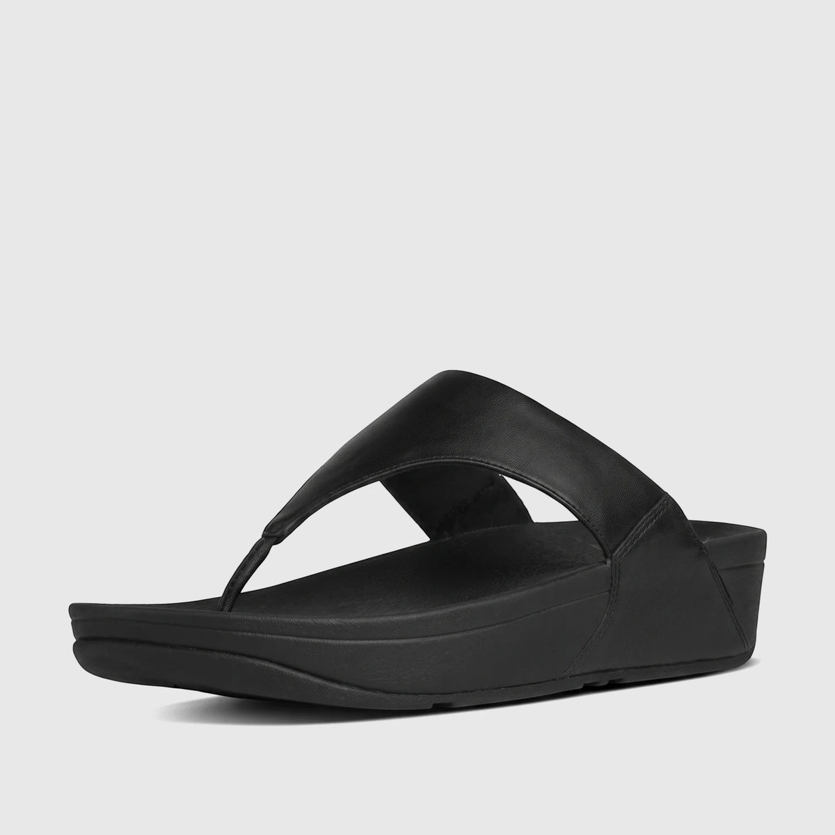 Black Fit Flop Lulu leather comfort thong sandal for ladies, shown from a side and top angle on a white background.