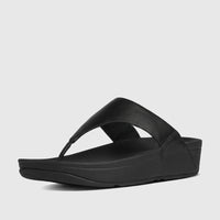 Black Fit Flop Lulu leather comfort thong sandal for ladies, shown from a side and top angle on a white background.