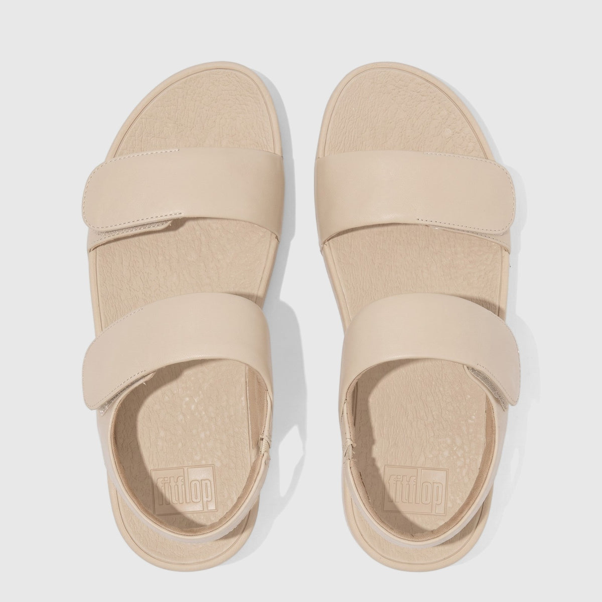 Light tan Fit Flop Lulu adjustable leather back strap comfort sandals, shown from a top-down view.