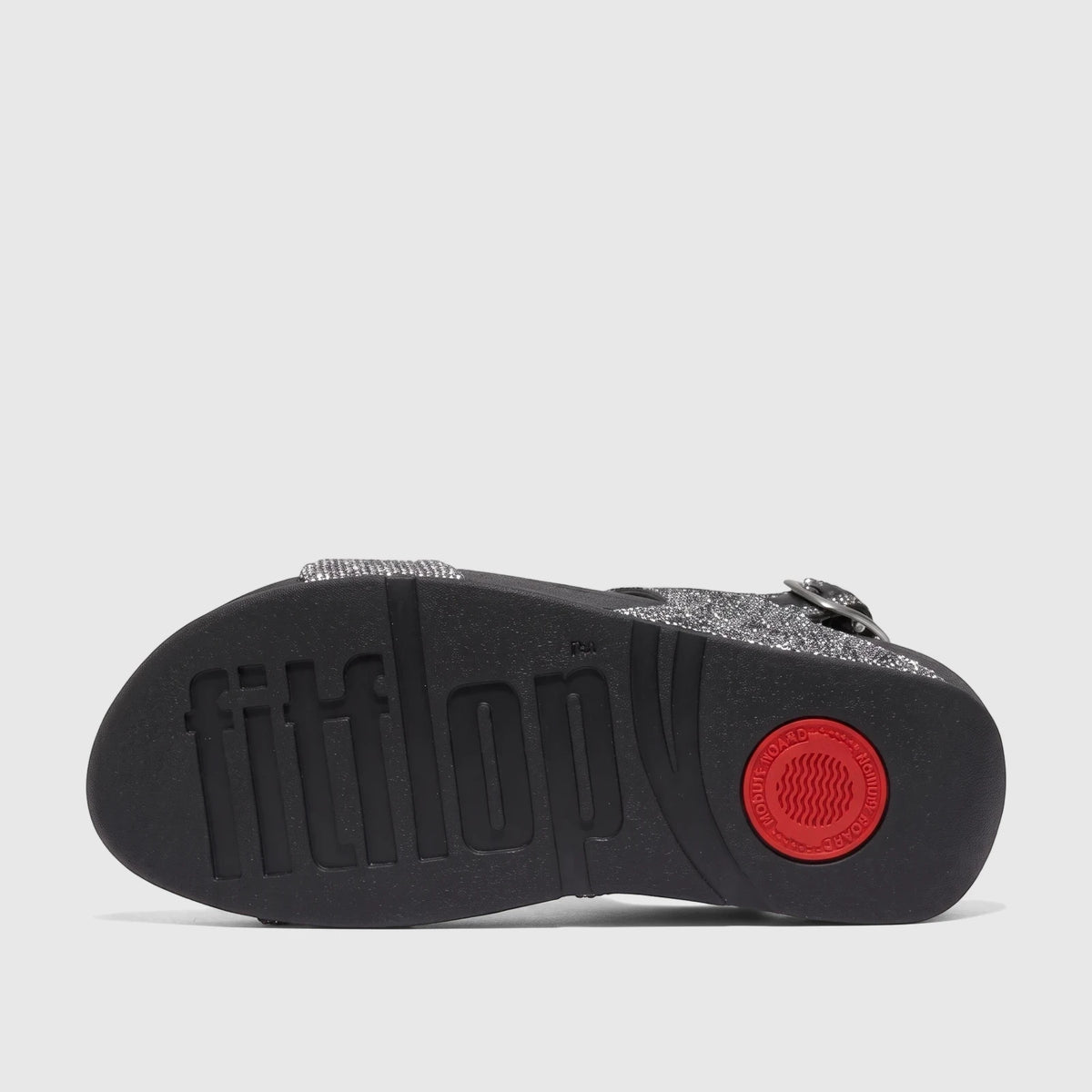 Fit Flop Lulu Glitterball back strap comfort sandal, black sole with silver glitter straps, shown from the bottom.