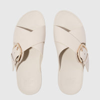 Off-white Fit Flop Lulu Resin Buckle Leather Cross Slide sandals, flat lay view, featuring criss-cross straps and a