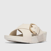Off-white Fit Flop Ladies Comfort Sandal Lulu featuring a large gold resin buckle and leather cross slides, captured from a