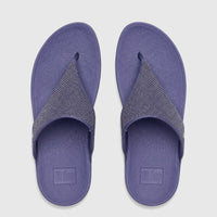 Pair of Fit Flop Lulu Shimmerglitz comfort sandals in Nightfall Blue, viewed from above, with textured gray straps.