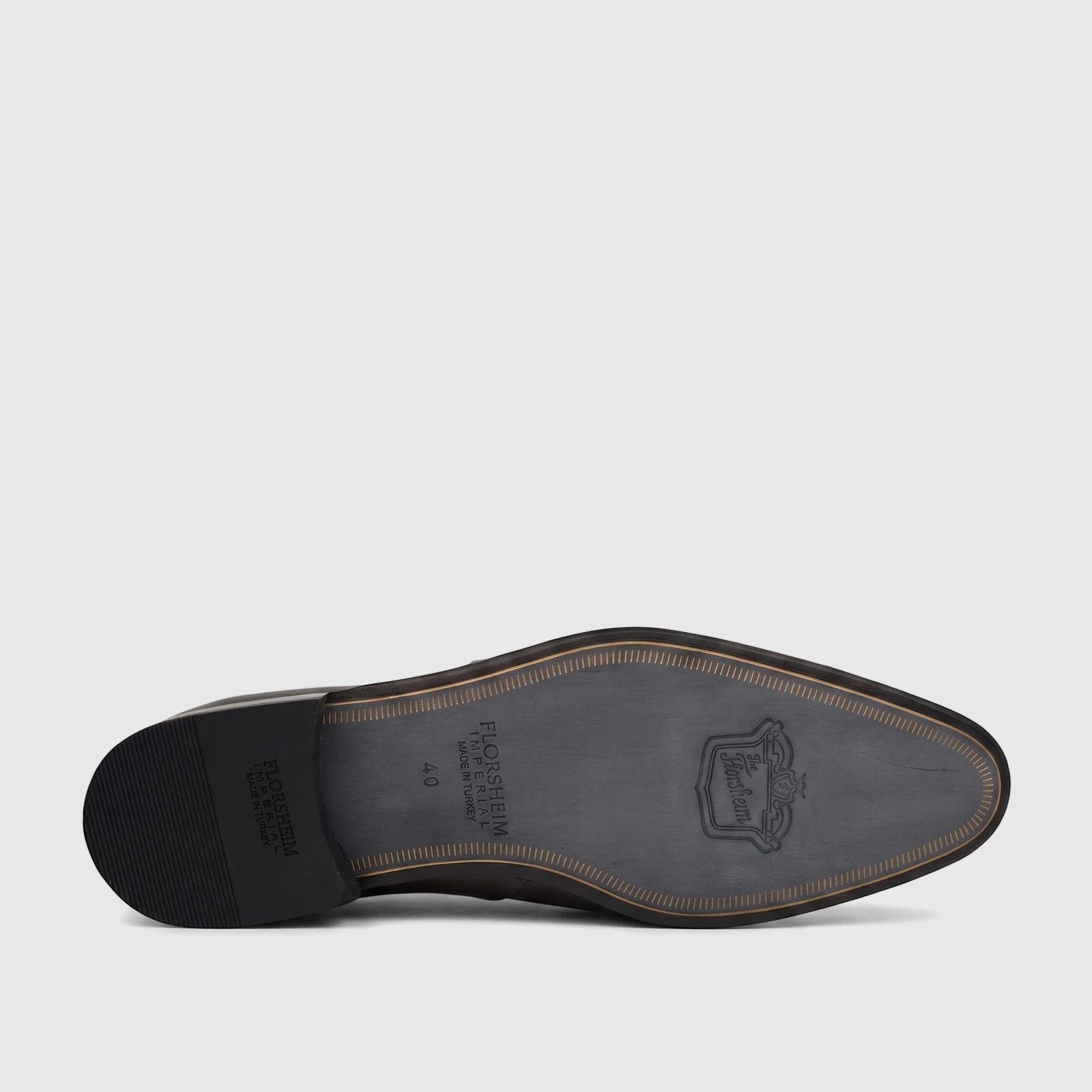 Sole of a brown Florsheim Imperial men's lace-up shoe, showing brand name and size 40 on the bottom.