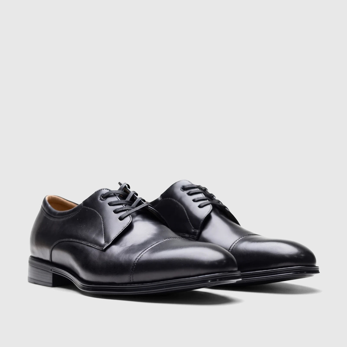 Pair of Florsheim Men's Comfortech Chateau black leather cap toe dress lace-up shoes, side view.