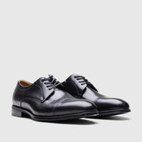 Pair of Florsheim Men's Comfortech Chateau black leather cap toe dress lace-up shoes, side view.