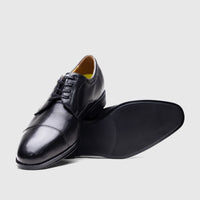 Black leather Florsheim Men's Comfortech Chateau cap-toe dress lace-up shoes, shown from the side.