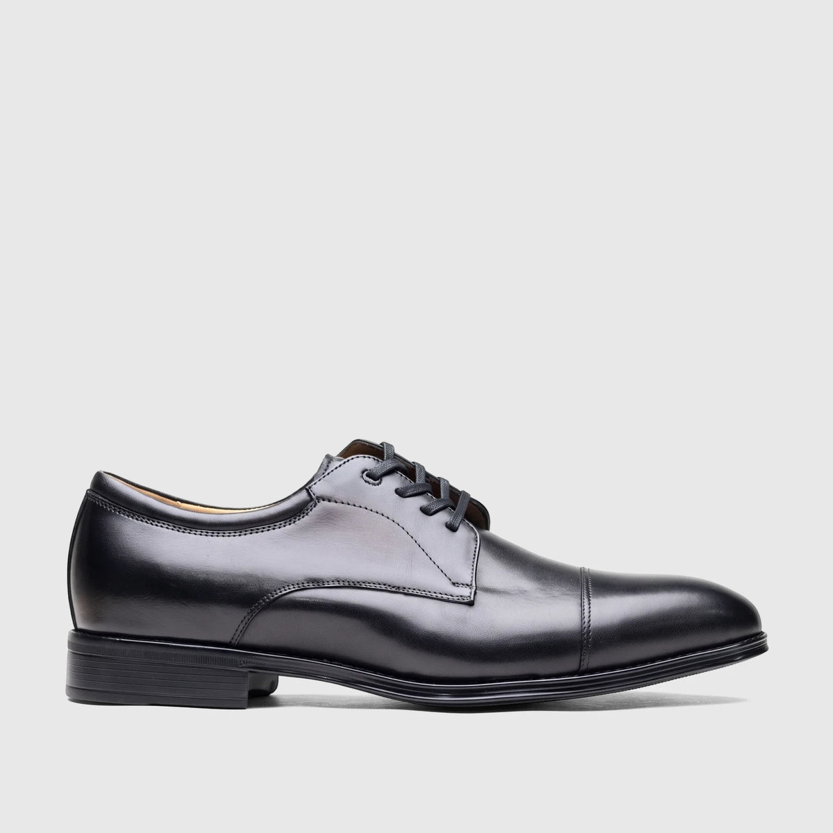 Black leather men's dress shoes with lace-up closure and a cap-toe design, presented in a side profile view.
