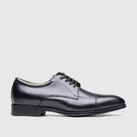Black leather men's dress shoes with lace-up closure and a cap-toe design, presented in a side profile view.