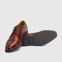 Florsheim Men's Comfortech Dress Lace Up Chateau cognac leather cap-toe shoes, presented with one upright and one on its
