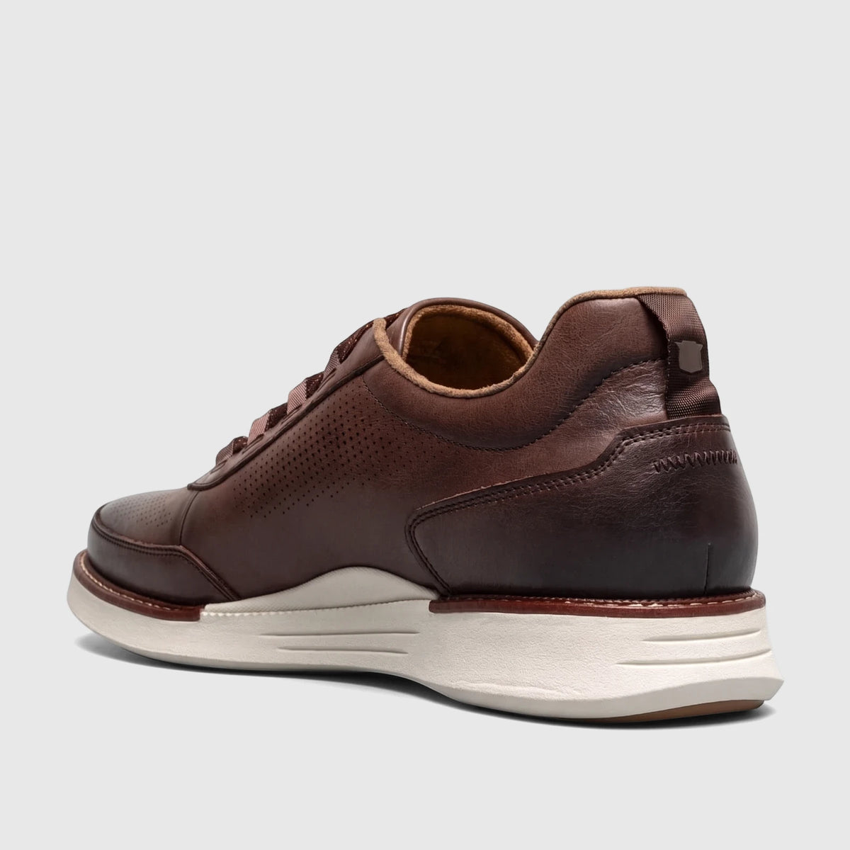 Florsheim Men's Launch Elastic Lace Slip On shoe in dark brown leather with perforated details and a white athletic sole,