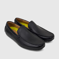 Black leather Florsheim Men's Loafer Motor Moc shoes, featuring visible stitching and yellow insoles, displayed side by side.