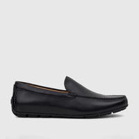 Black leather Florsheim Men's Loafer Motor Moc shoe, model 181153/001 FT42, featuring classic stitching, presented in a side
