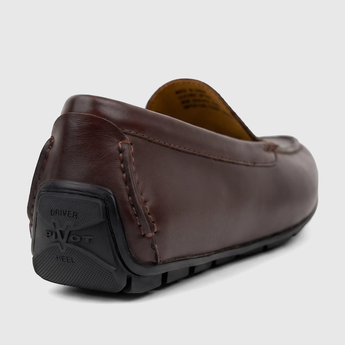 Dark brown leather Florsheim Men's Loafer Motor Moc, viewed from a low angle showing the detailed stitching and black rubber