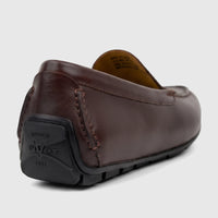 Dark brown leather Florsheim Men's Loafer Motor Moc, viewed from a low angle showing the detailed stitching and black rubber