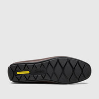 View of the black sole of a dark brown Florsheim Men's Loafer Motor Moc, featuring 'COMFORTTECH' and textured grip patterns.
