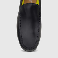 Close-up front view of a Florsheim Men's Motor Moc loafer in black leather with mocc-toe stitching.