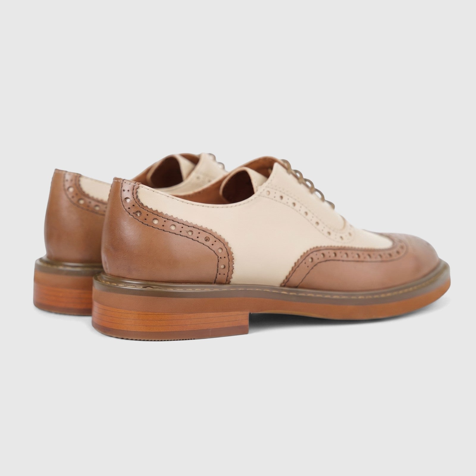 Pair of Formale Ladies leather full brogue wingtip lace-up shoes in brown and cream, viewed from the rear-right side.