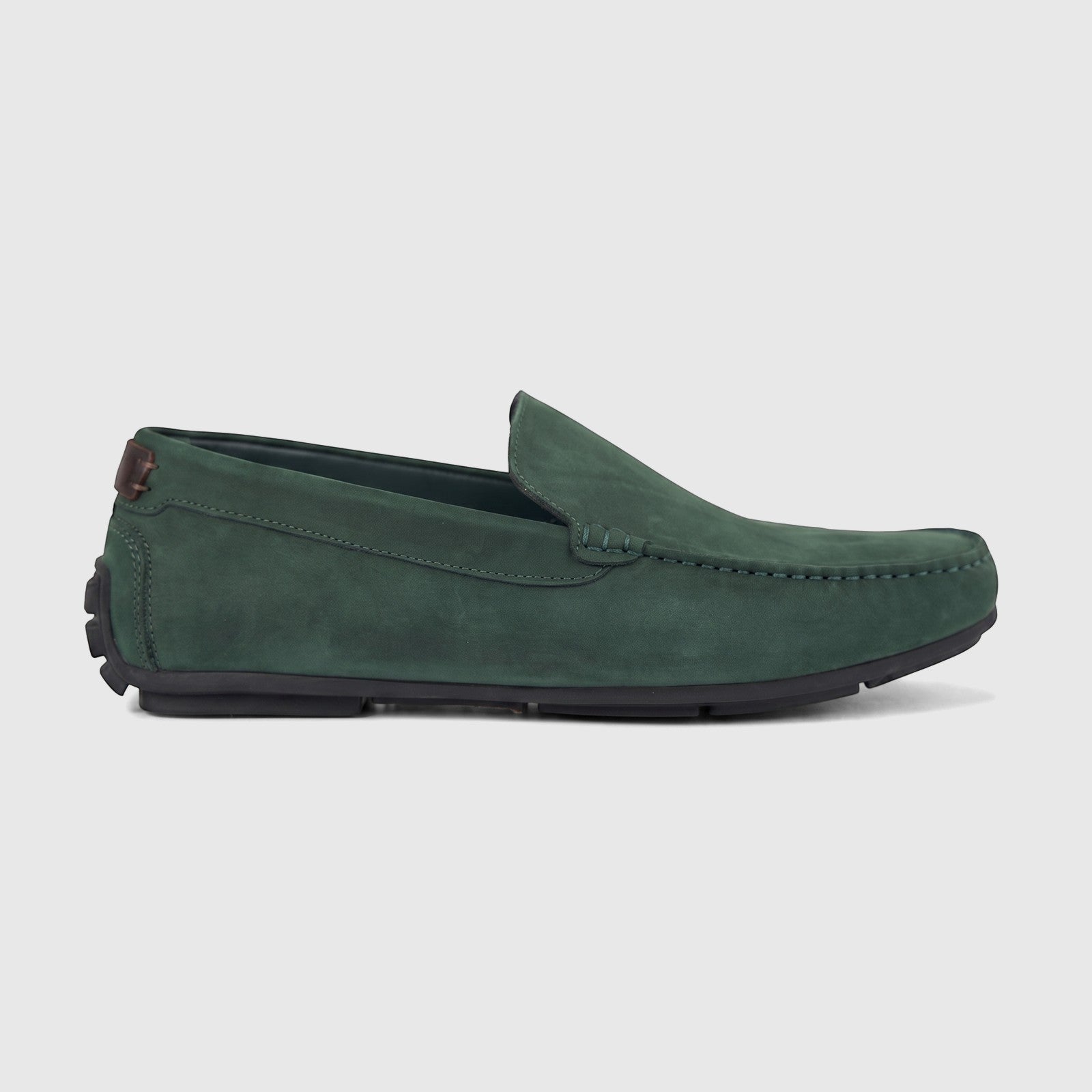 Formale men's leather loafer in dark green suede-like material, featuring a side profile view of the shoe on a white