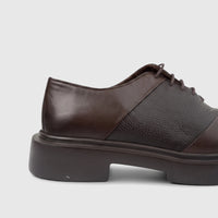 Close-up side view of Formals brown leather chunky sole lace-up Oxford shoes, showcasing smooth and pebbled textures.