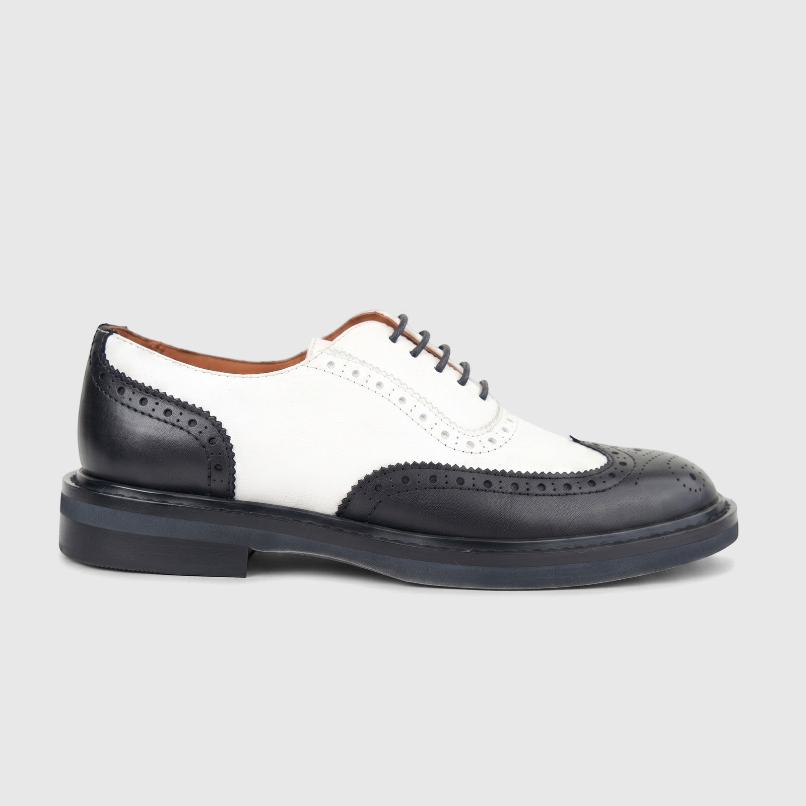 Formale's black and white leather full brogue wingtip lace-up shoe for ladies, side view, showcasing intricate perforations