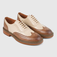 Pair of Formales ladies' leather full brogue wingtip lace-up shoes in brown and cream, showcasing intricate perforations and
