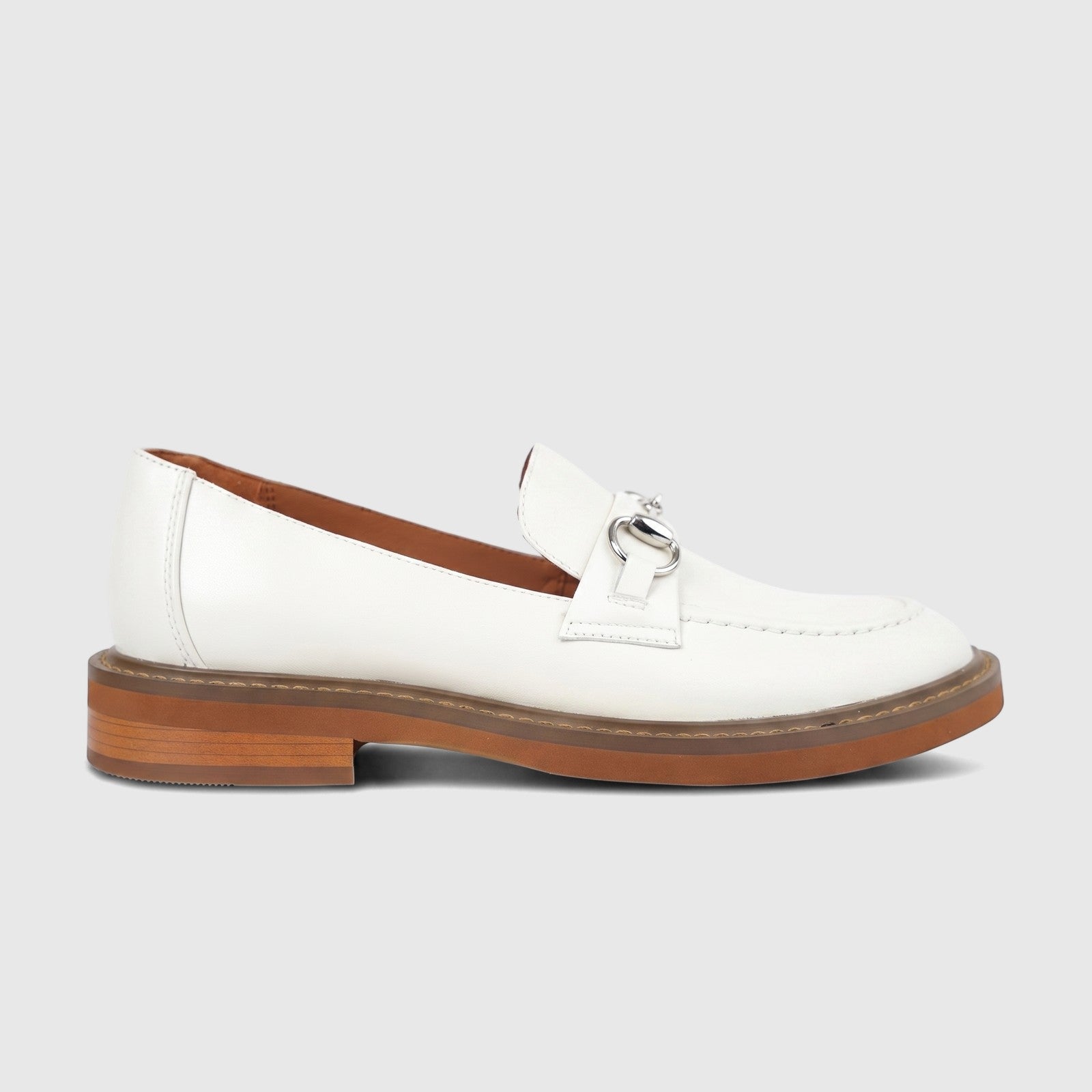 Off-white Formals Ladies Leather Loafer FD265016 with a silver bit detail and brown sole, shown in a side profile.