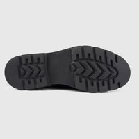 Bottom view of a Formales men's black chunky sole, showing textured rubber tread and embossed branding.