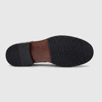 Bottom view of a Formales Men's black leather chunky sole lace-up shoe, showing the ribbed sole and heel with branding.