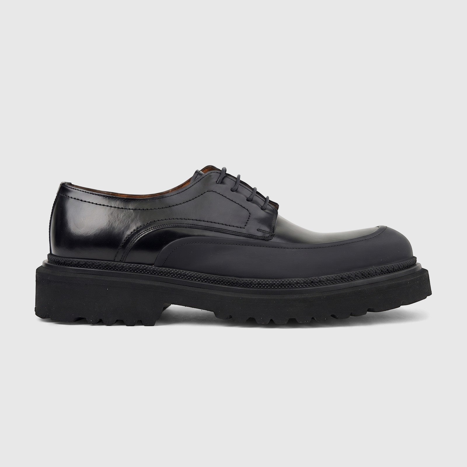 Men's Formales black leather chunky sole lace-up shoe, side view. Features a polished upper and a thick, textured lug sole.