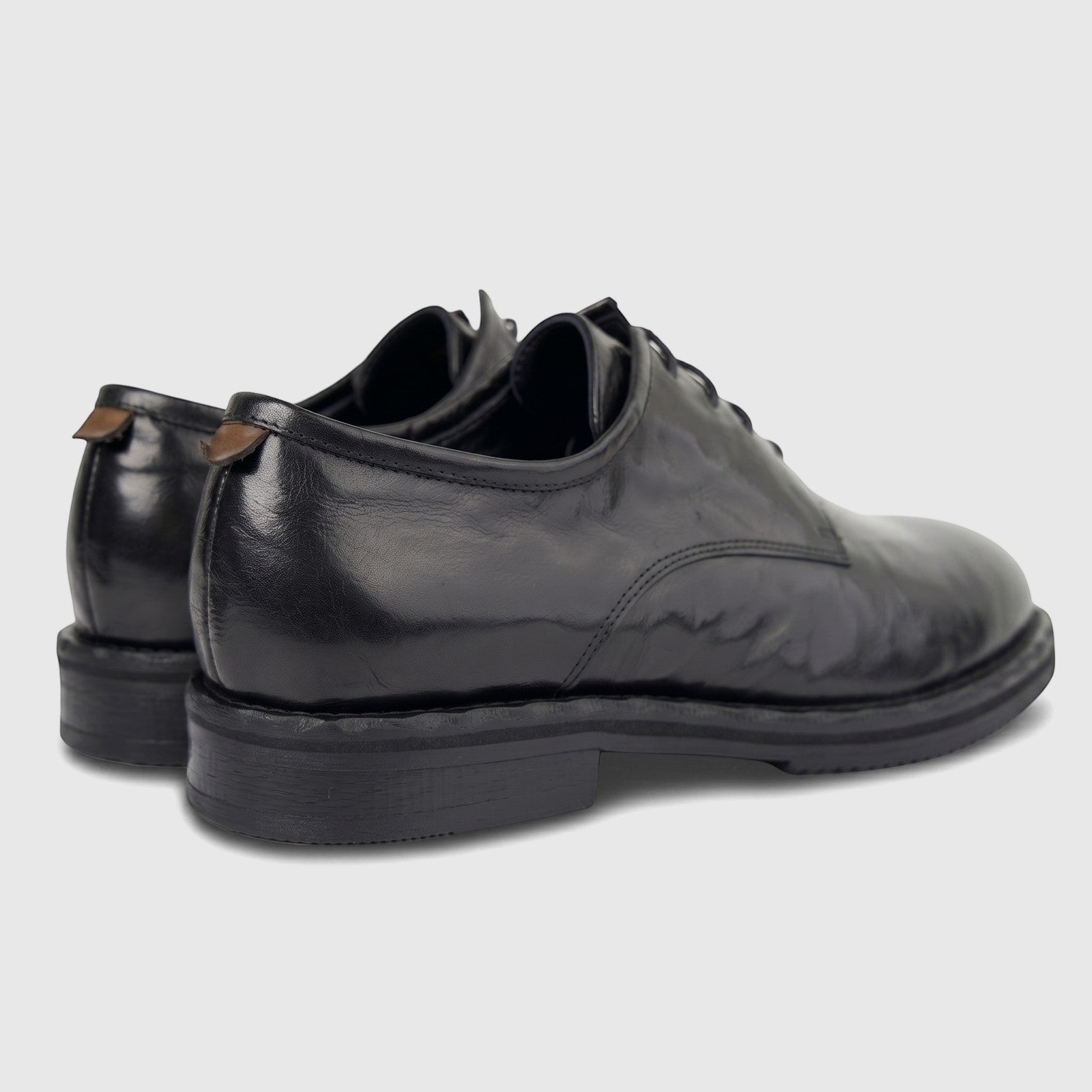 Formales Men's black leather lace-up shoes with chunky soles, shown from a side and back view in a studio setting.