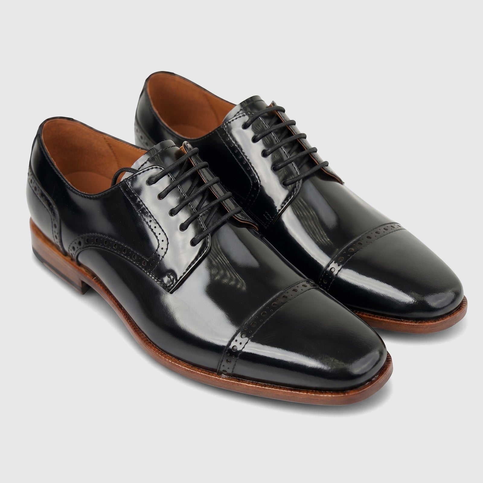 Formale's men's black leather cap-toe oxford dress shoes with lace-up closure and brogue detailing.