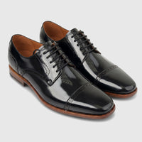 Formale's men's black leather cap-toe oxford dress shoes with lace-up closure and brogue detailing.