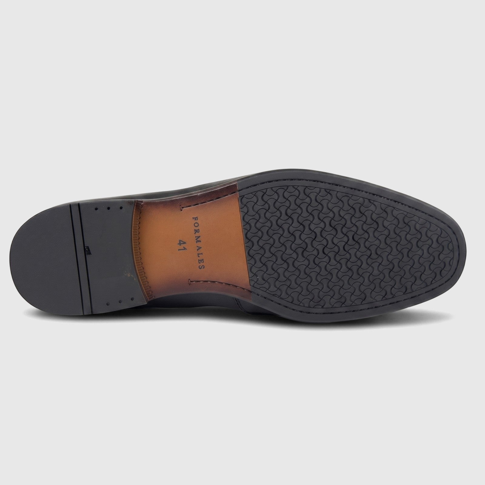 Bottom view of a Formales men's black leather loafer, featuring a textured rubber grip and brown leather sole with brand