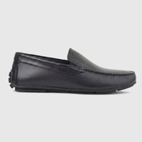 Formales Men's black leather loafer, side view, featuring moc-toe stitching and a detailed rubber sole.