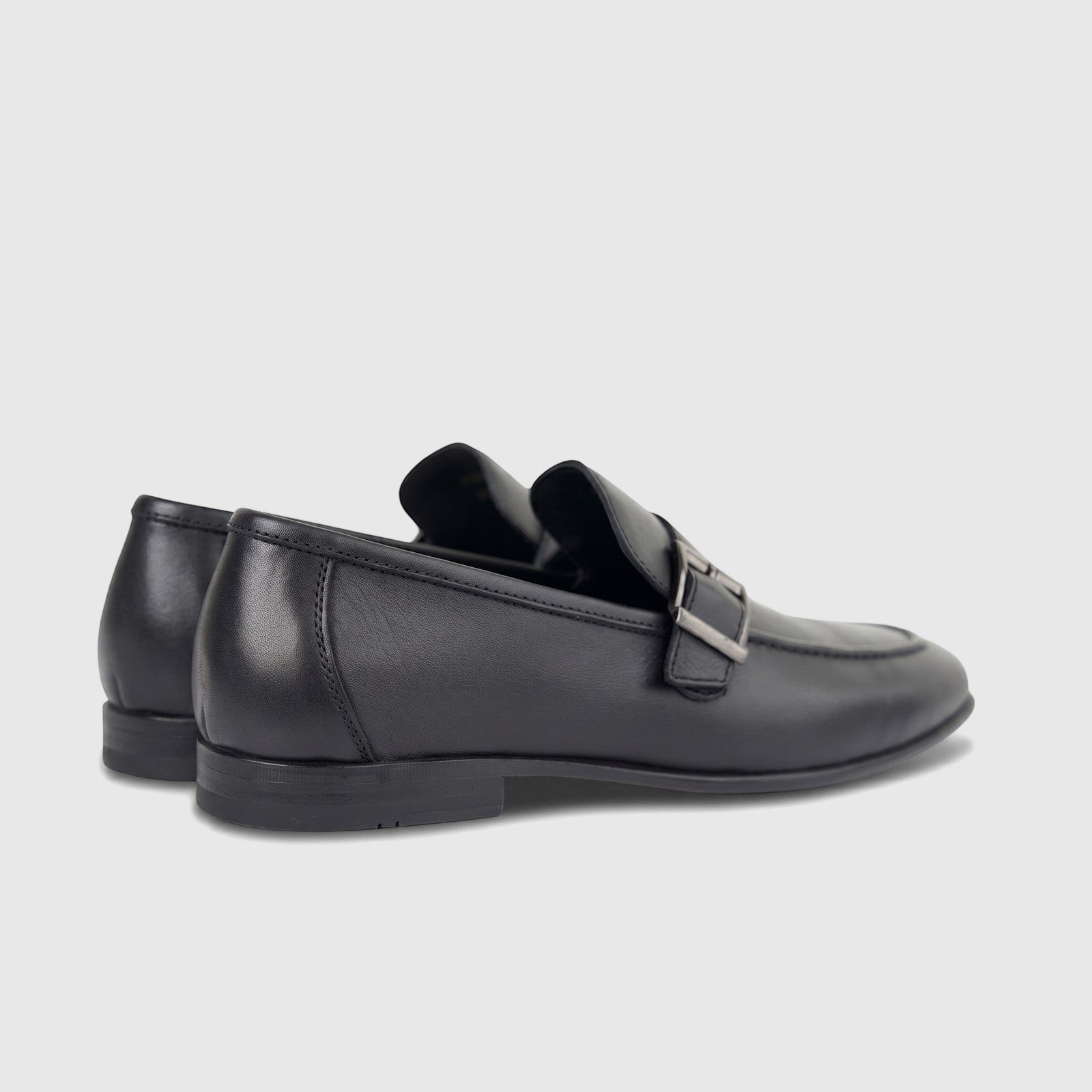 Formales Men's black leather loafer with a metal buckle, shown from a side view, suitable for formal wear.