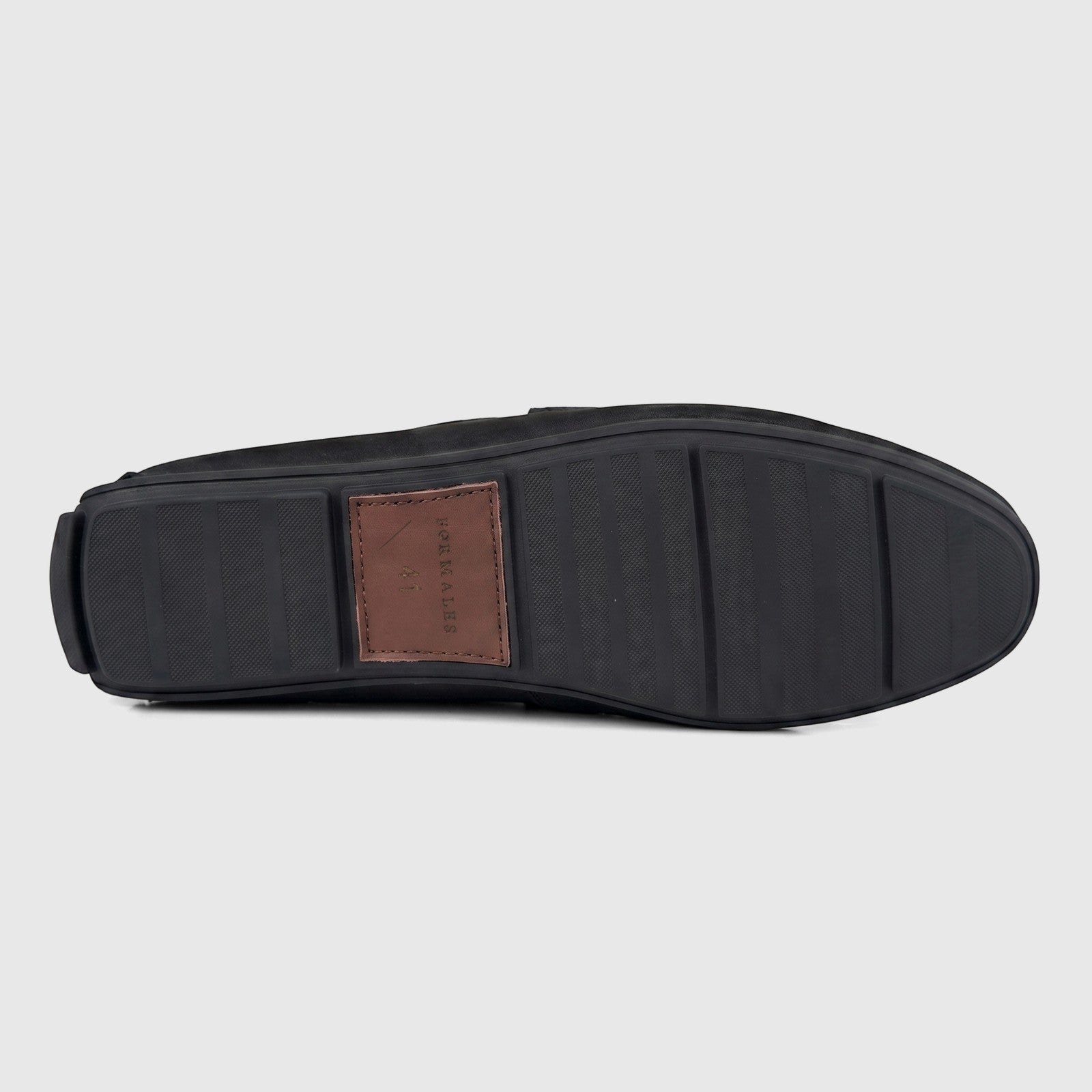 Bottom view of a Formales Men's Black Leather Loafer, showcasing the patterned rubber sole with a branded brown leather