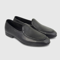 A pair of men's black leather loafers, featuring a sleek design with detailed stitching, presented on a white background.