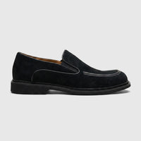 Men's Formales black suede slip-on shoe in a profile view, showcasing the textured material and classic design.