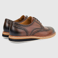 Pair of Formale's men's brown leather lace-up casual shoes, featuring brogue detailing and distinctive layered soles.