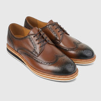 A pair of Formales men's brown leather casual lace-up shoes with black wingtip details, displayed from an angled view.