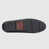 Bottom view of a Formales men's green leather loafer, showcasing the black rubber sole with branded details.