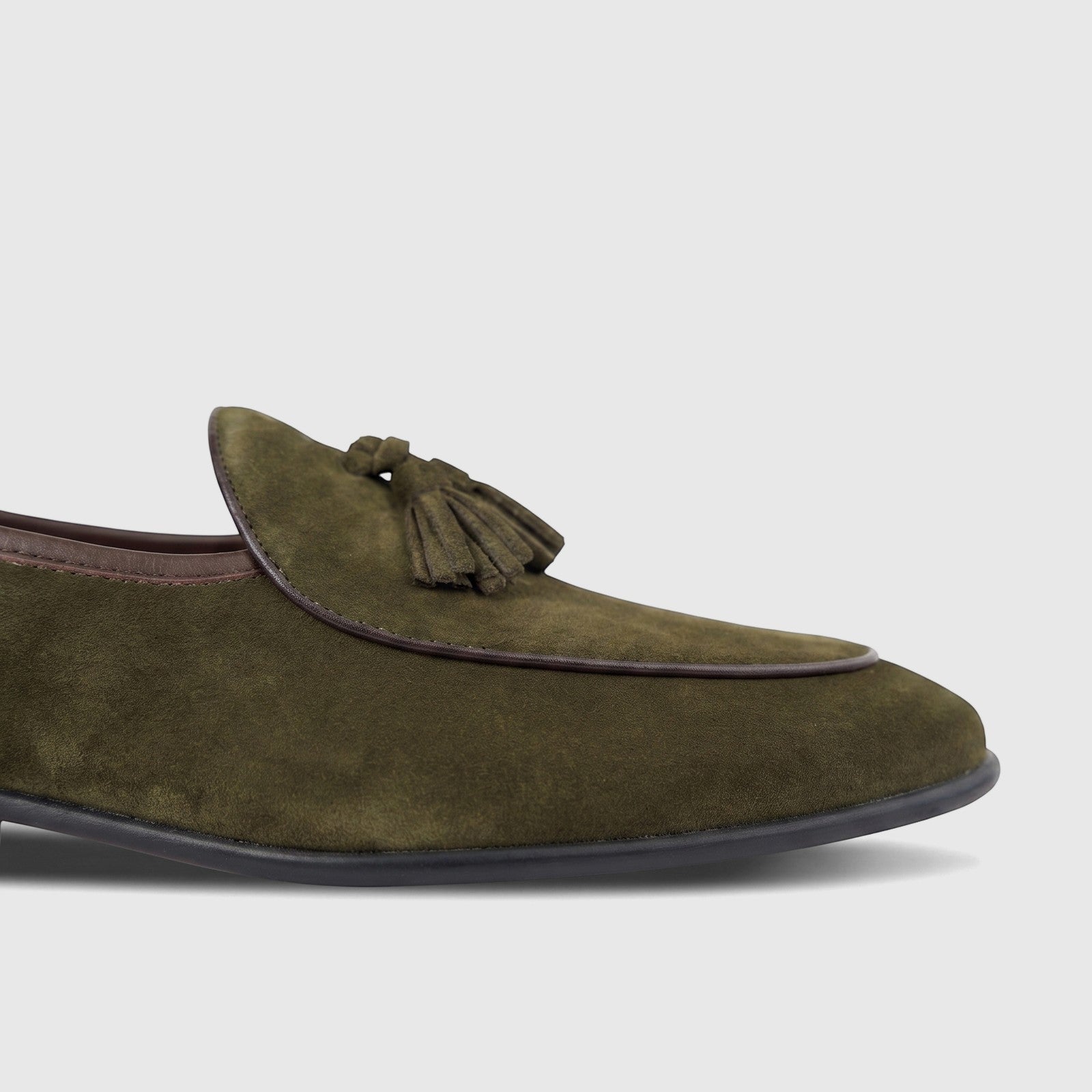 Formales Men's Green Suede Tassel Loafer, model FT268003, featuring dark brown piping and a black sole, side view.
