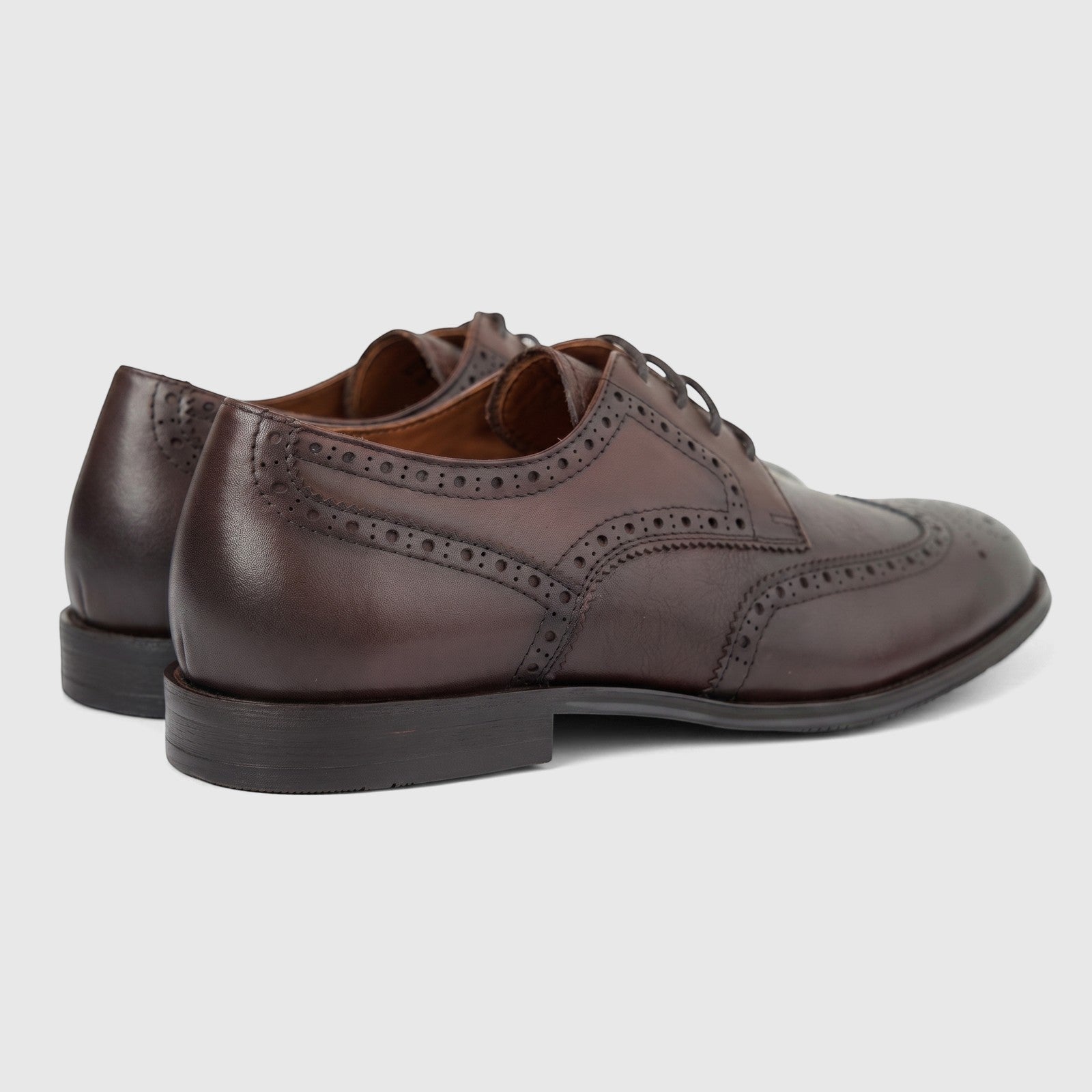 Coffee brown leather men's brogue dress shoes with lace-up detail, shown in a side-back view on a white background.