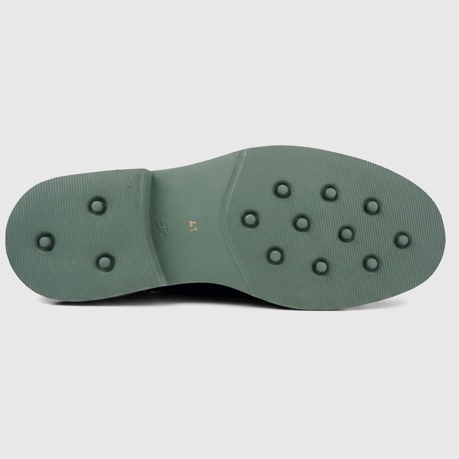 View of the olive green chunky sole of a Formales men's leather brogue lace-up shoe with grip studs.
