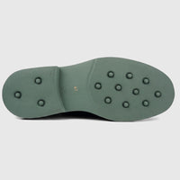 View of the olive green chunky sole of a Formales men's leather brogue lace-up shoe with grip studs.