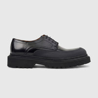 Men's Formales black leather chunky sole lace-up shoe, side view. Features a polished upper and a thick, textured lug sole.