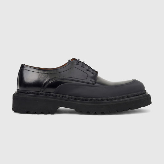 Men's Formales black leather chunky sole lace-up shoe, side view. Features a polished upper and a thick, textured lug sole.