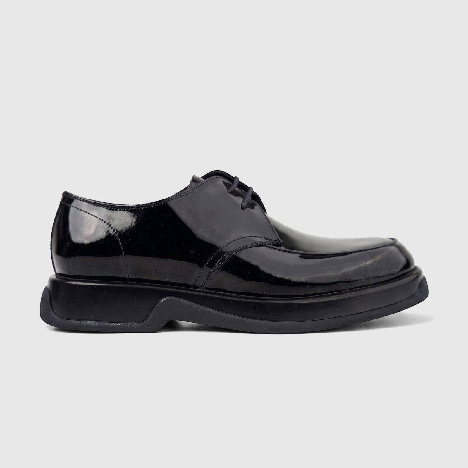 Men's black patent leather chunky sole lace-up formal shoe, viewed from the side on a white background.